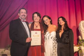 James and Michelle Sutton receiving award from Luisa Omielan at the Pure Beauty Awards
