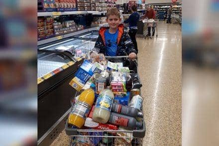 Lincoln Wright (pictured) read four books over a 10-hour period, raising a total of £103 for the Hope Centre community food club.
