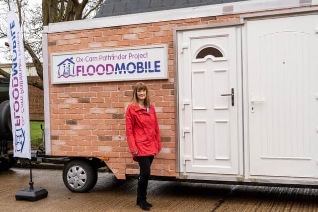 Flood resilience champion Mary Long-Dhonau OBE stands by the Floodmobile