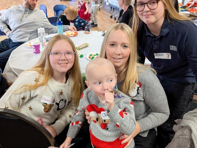 Oliver with mum Georgina and sisters Poppy and Rosie