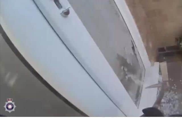 Police smashed their way into the flat.