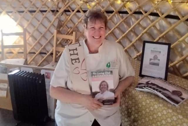 Natasha with her new book in the Sol Haven yurt.