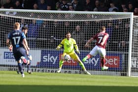 Sam Hoskins gives Cobblers the lead with a wonderful volleyed finish against Derby County. Pictures: Pete Norton