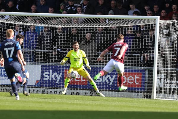 Sam Hoskins gives Cobblers the lead with a wonderful volleyed finish against Derby County. Pictures: Pete Norton