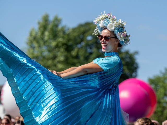 A performer on stilts helping to warm up race goers taking part in the Race For Life at Abington Park in Northampton on Sunday, July, 12, 20026. Photo by David Jackson.
