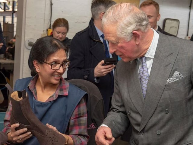Prince Charles speaks to Palo Kaur as he visits Royal shoemakers Tricker’s