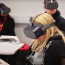 Kardi Somerfield and her students try out VR headsets