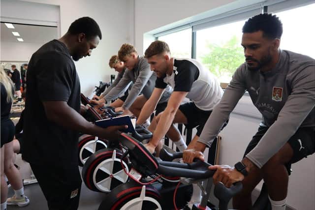 University of Northampton staff and student evaluate NTFC players at Waterside campus.