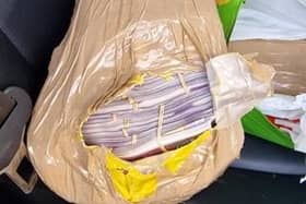 In the back of the vehicle was tightly wrapped bundles of cash totalling more than quarter of a million pounds.