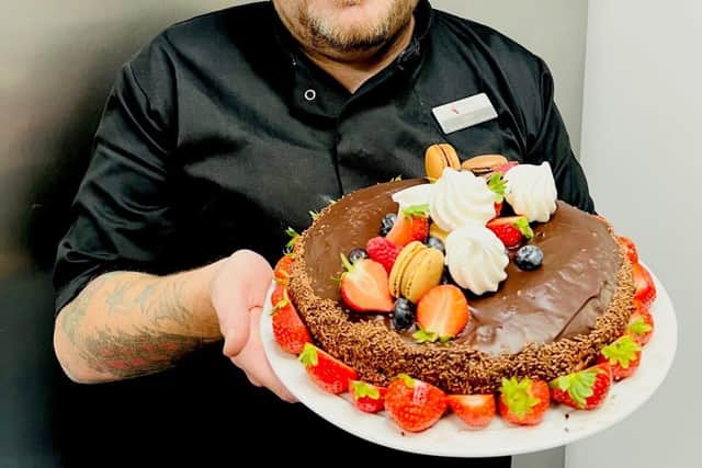 Simon with his showcase chocolate and strawberry gateaux