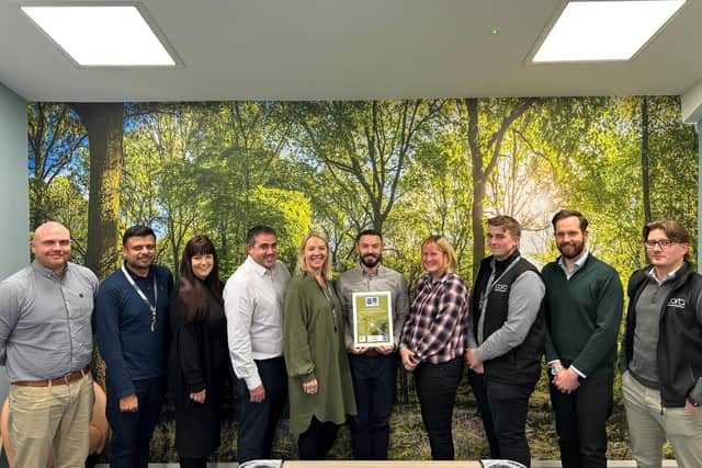 Members of the Cora Homes team with the new certificate