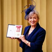 Dame Andrea Leadsom poses after her investiture by the Prince of Wales at Buckingham Palace