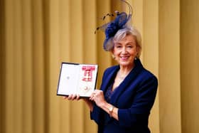 Dame Andrea Leadsom poses after her investiture by the Prince of Wales at Buckingham Palace