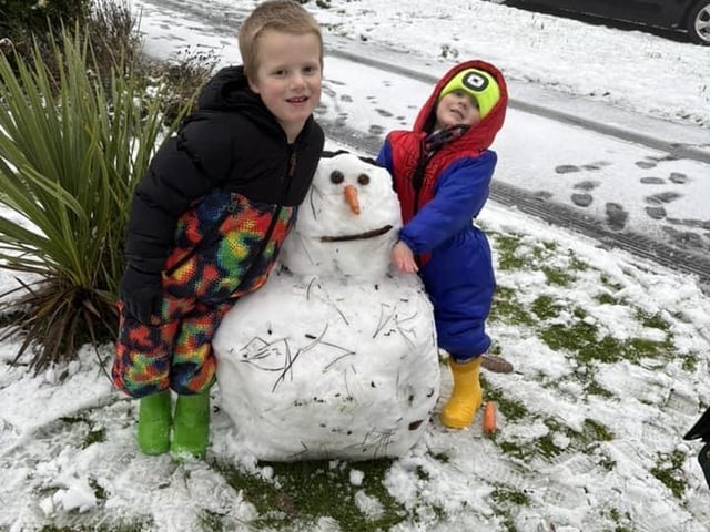 Proud children with their creation.