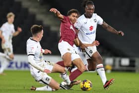 Action from the Cobblers' 3-2 defeat at MK Dons on Tuesday (Picture: Pete Norton)