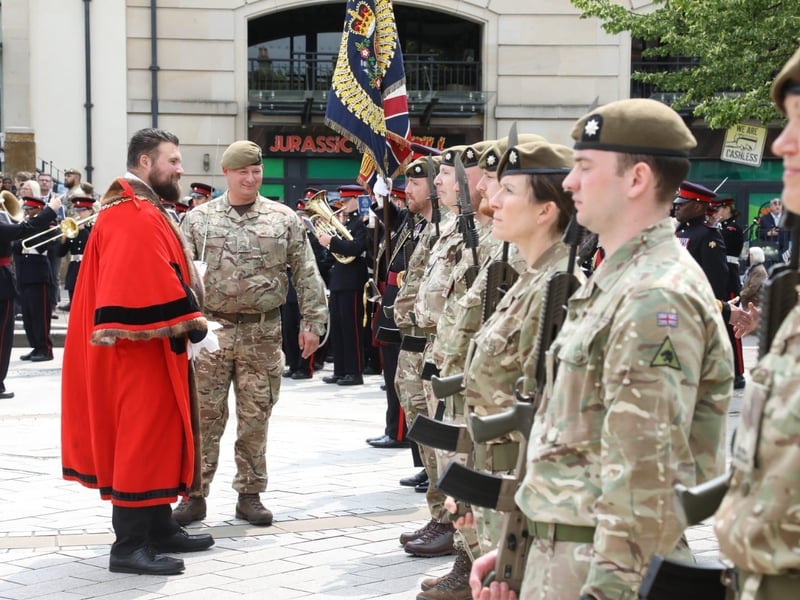 Kettering town centre: crowds line town centre to welcome The Royal Anglian Regiment for Armed Forces Day parade /National World