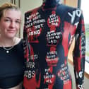 Molly Anne Barchard, 22, pictured with her full length bodysuit displaying some of the explicit messages she has received on Tinder.
