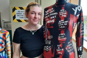 Molly Anne Barchard, 22, pictured with her full length bodysuit displaying some of the explicit messages she has received on Tinder.