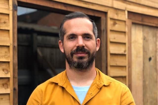 Phillip Lyman, the founder and owner of Driftwood Vintage Furniture.