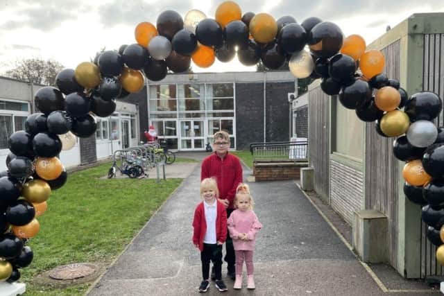 Lumbertubs Primary School's oldest pupil Darius, 11, and the two youngest pupils Alise, 4, and Alisa, 3, when they celebrated their 50 year anniversary.