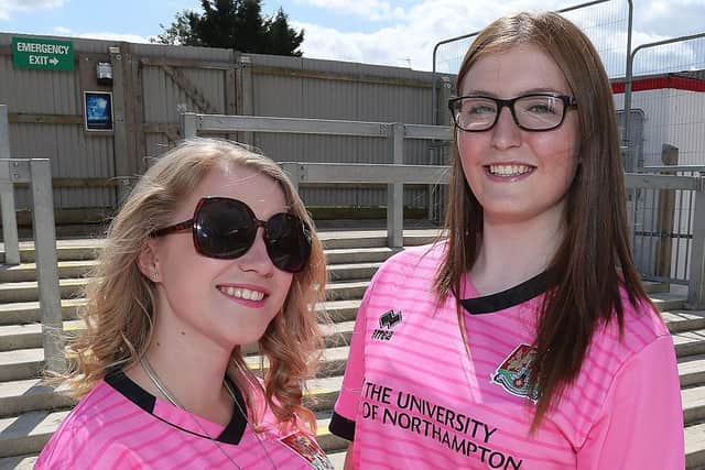Northampton Town fans Hollie Callen and Kaysha Marlow wear the teams new pink away top during the Pre-Season Friendly match between Brackley Town and Northampton Town at St James Park on July 25, 2015.