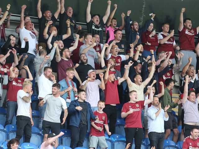2021: Northampton Town fans celebrate victory at the final whistle during the Sky Bet League Two match between Colchester United and Northampton Town at JobServe Community Stadium on August 14, 2021 in Colchester, England. (Photo by Pete Norton/Getty Images)
