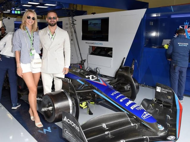 Model Vogue Matthews and reality star husband Spencer in the Williams Racing garage