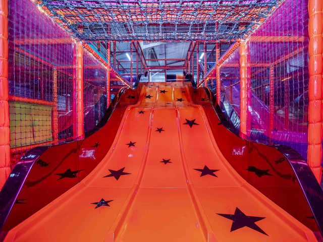 There is a new sensory room, car wash role play zone, two large ball pits with ball showers, and a sports court with astroturf on the top level.