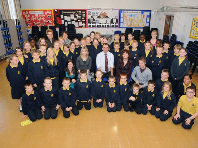 Bob, pictured here with Year 6 pupils and staff, in 2009