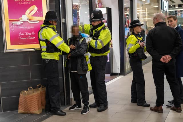 A 44-year-old was arrested on suspicion of shoplifting as the policing minister watched on.