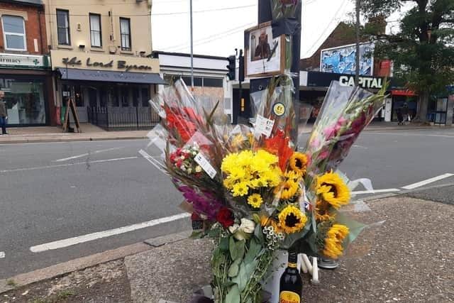 Flowers left at the scene of the fatal collision in Kettering Road.