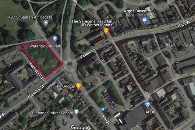 The empty lot borders a residential area to the west and Daventry town centre to the east.