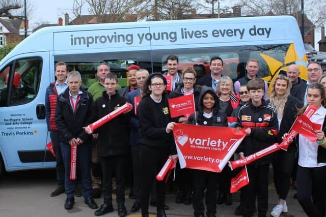 Staff and students of Northgate School with Travis Perkins and Variety staff
