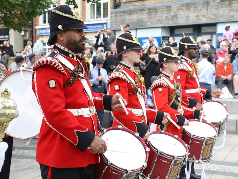 Kettering town centre: crowds line town centre to welcome The Royal Anglian Regiment for Armed Forces Day parade /National World