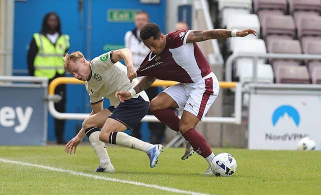 Ryan Battrum almost drags over Elliott List near the touchline