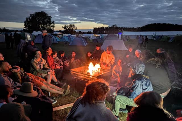 Young people around a campfire at Woodcraft Folk