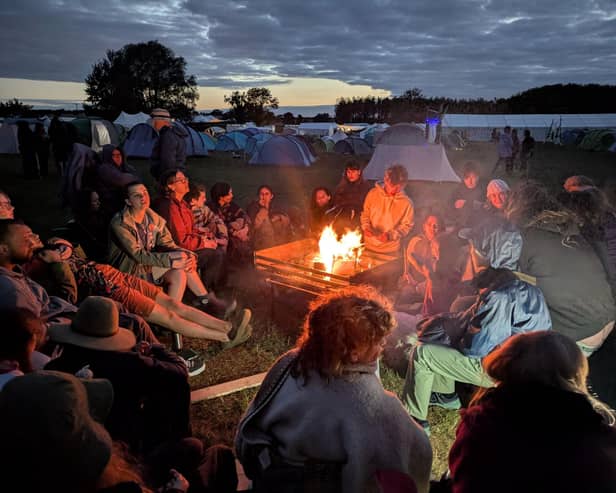 Young people around a campfire at Woodcraft Folk