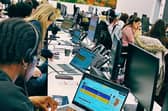UON Students sat a rows of computer monitors at the  Silverstone Event Control Room.