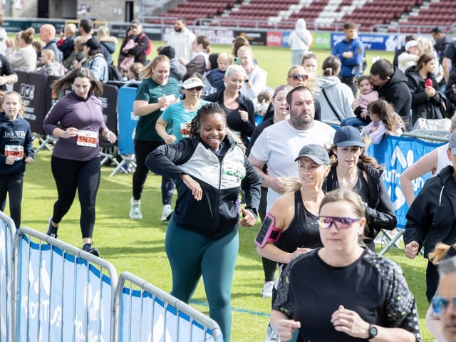 Hundreds of runners braved showers and wind to take on the race on Sunday (May 25), which started and finished at Sixfields stadium.