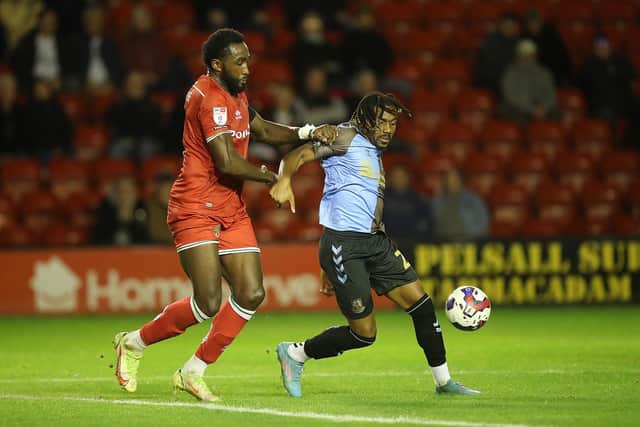 Josh Eppiah battles for the ball in the defeat at Walsall