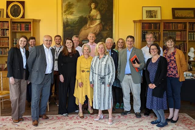 Pictured is the Northamptonshire team, who were visited by Action for Happiness' co-founder Lord Layard and Alison McGovern MP, the shadow minister for employment, at Delapre Abbey.