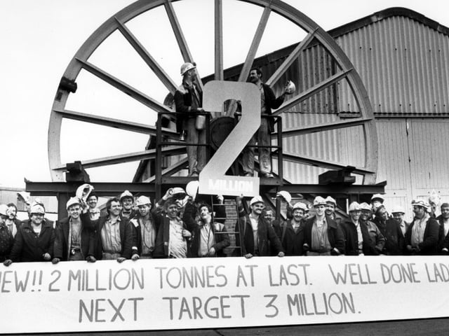 Jubilant miners celebrating reaching two million tonnes in 1989