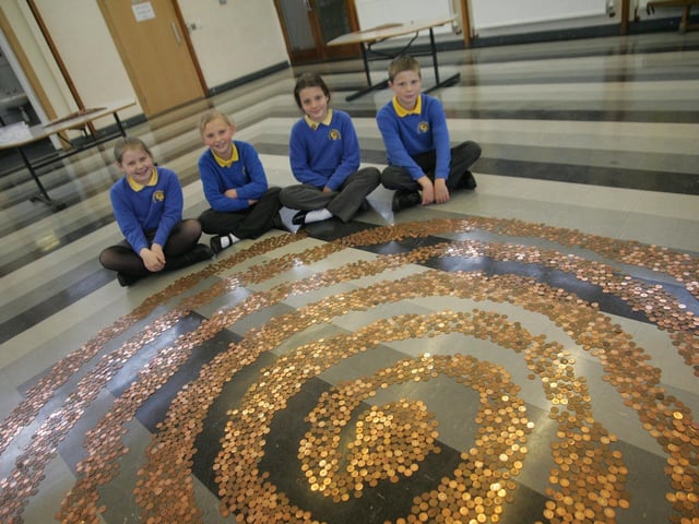 Headlands Primary School pupils have been collecting 1p and 2p copper coins to make a pattern with in the school hall (and pyramids). L_R are Emily Ashby, Eliza Pawley, Charlotte Hewitt and Jon Henson all aged 10