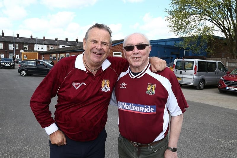 Northampton Town fans attend the game in old shirts from previous seasons during the Sky Bet League One match between Bury and Northampton Town at Gigg Lane on April 22, 2017.