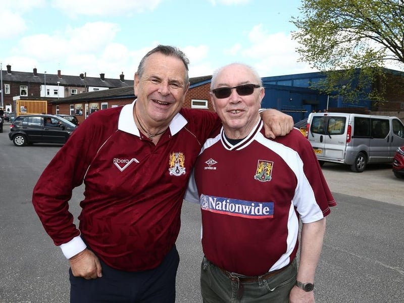 Northampton Town fans attend the game in old shirts from previous seasons during the Sky Bet League One match between Bury and Northampton Town at Gigg Lane on April 22, 2017.