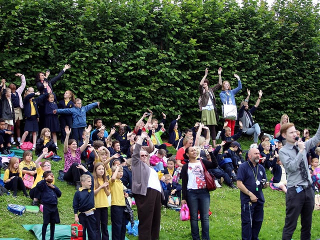 Crowds waving goodbye to Bob at his retirement party