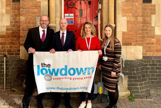 Michael Jones with staff from The Lowdown.