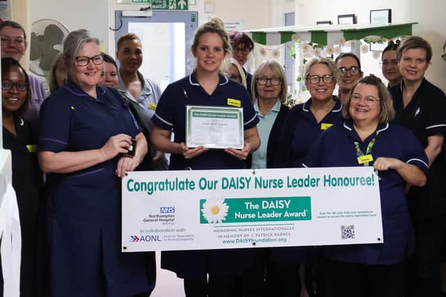 Lead Nurse for Maternity Immunisation Leigh-Anne Spinelli with the award and her team and nursing leaders.