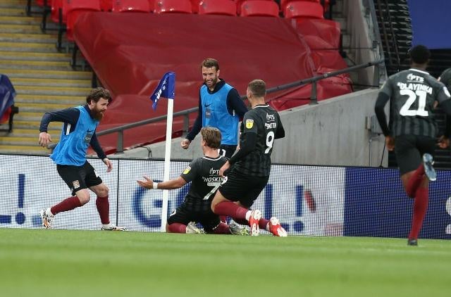 Hoskins rebounded from his red card by scoring Town's third goal against Exeter in the play-off final at an empty Wembley Stadium.