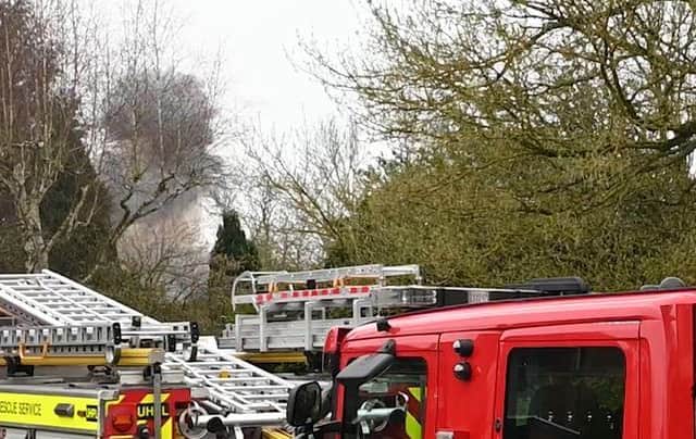 Smoke billows over Quinton as bomb squad experts blow up 62 World War Two grenades dug up on Sunday